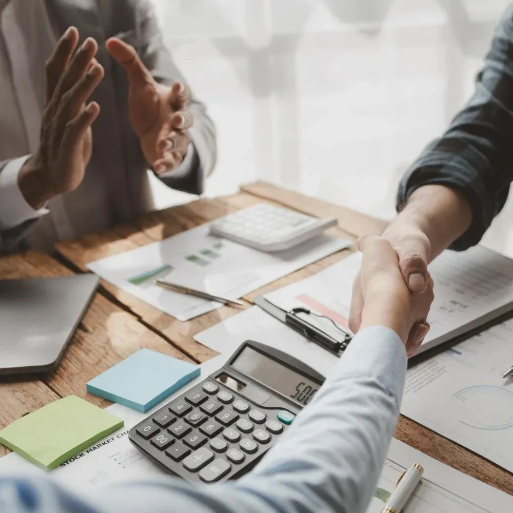 shaking hands with financial agency