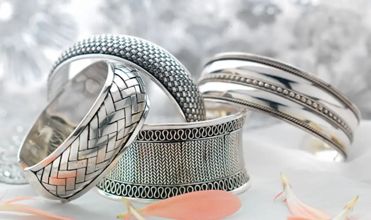 A set of intricately designed sterling silver bracelets A set of intricately designed sterling silver bracelets