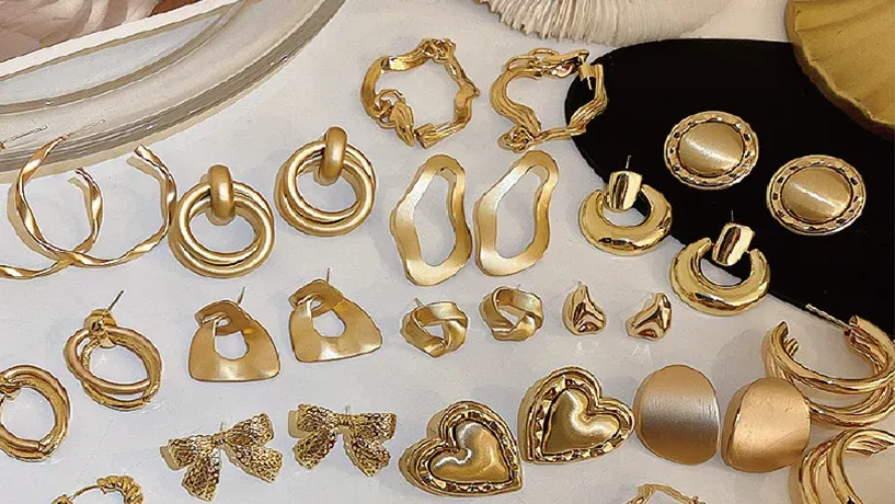 assortment of gold earrings in various designs