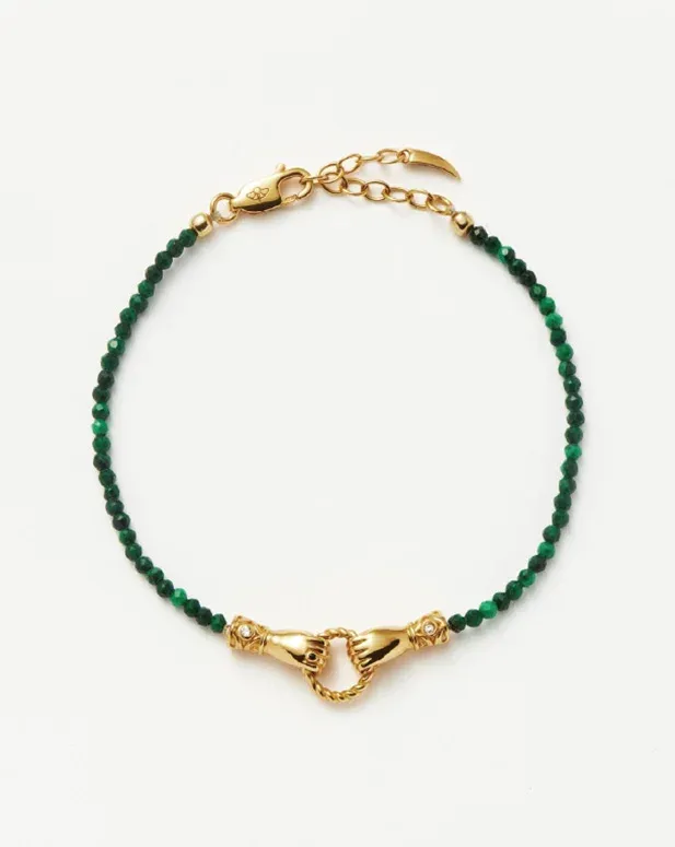 green beaded bracelet with a gold clasp