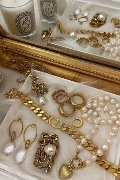Jewelry box with gold and pearl rings, bracelets, and earrings Jewelry box with gold and pearl rings, bracelets, and earrings