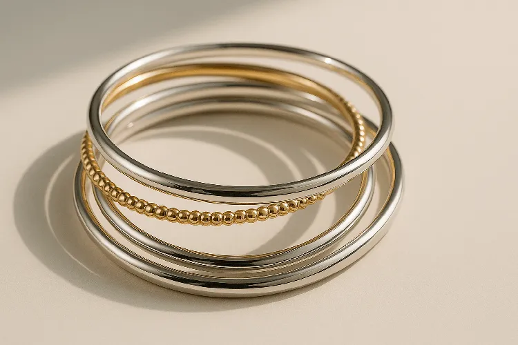 Harmonious mix of silver and gold bracelets. Harmonious mix of silver and gold bracelets.