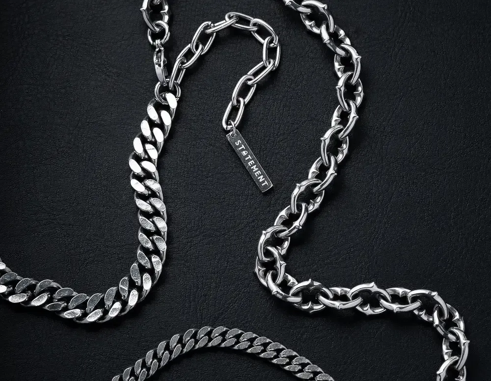 Stainless steel chains on black leather Stainless steel chains on black leather