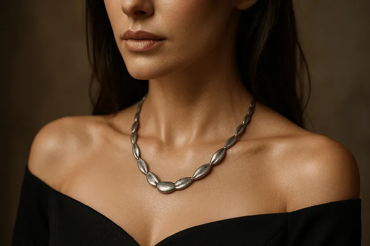 Elegant woman wearing a tarnished sterling silver necklace Elegant woman wearing a tarnished sterling silver necklace