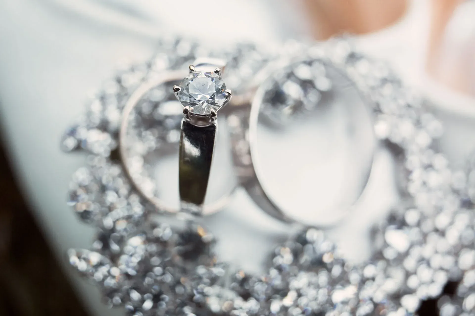 Close up of a silver ring with a large diamond Close up of a silver ring with a large diamond