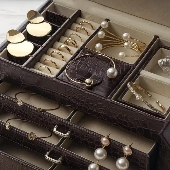 Jewelry box with various gold and pearl jewelry items