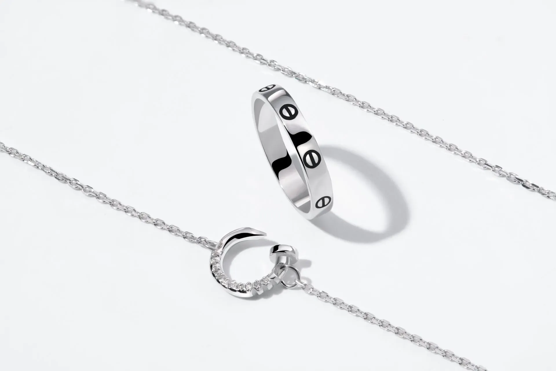 Silver ring and moon shaped pendant on delicate chains