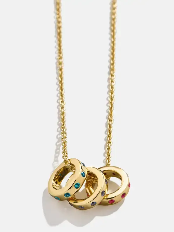 Stainless steel necklace with three interlocking rings featuring colorful gemstones
