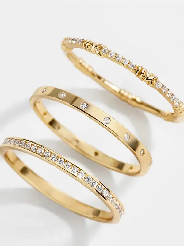 Three stainless steel rings each accented with sparkling stones