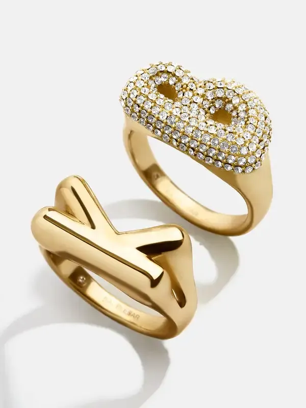 Two statement rings one with crystals one smooth