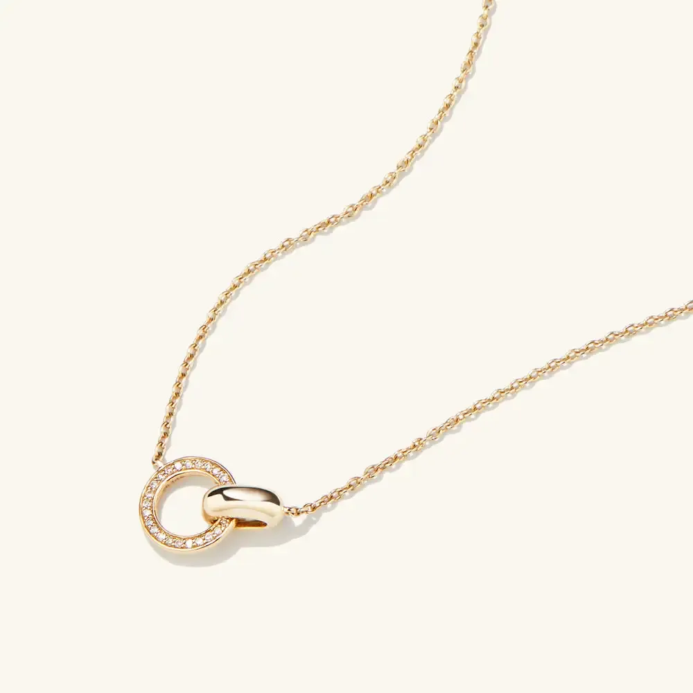 necklace with interlocking rings one set with diamonds