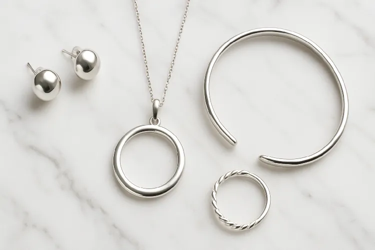 Elegant silver-plated jewelry on marble background Elegant silver-plated jewelry on marble background
