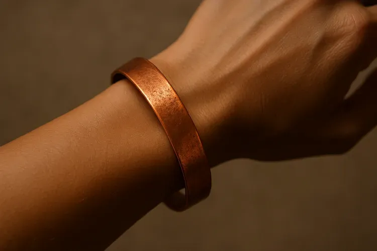 A hand adorned with a stylish copper bracelet, symbolizing both beauty and wellness. A hand adorned with a stylish copper bracelet, symbolizing both beauty and wellness.