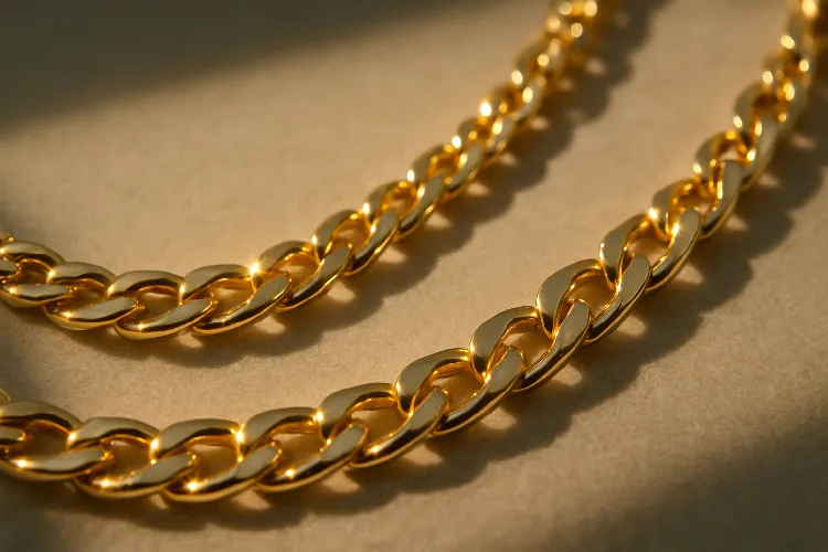 Close-up of a 14k gold necklace highlighting intricate design Close-up of a 14k gold necklace highlighting intricate design