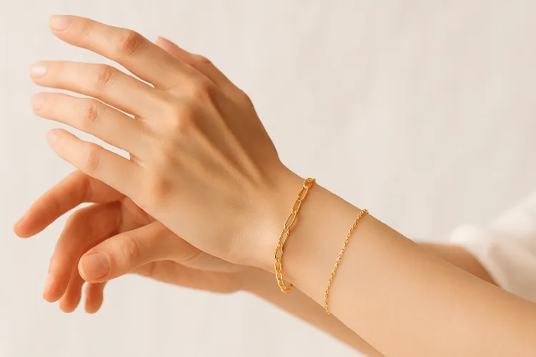 Elegant hands wearing permanent jewelry Elegant hands wearing permanent jewelry
