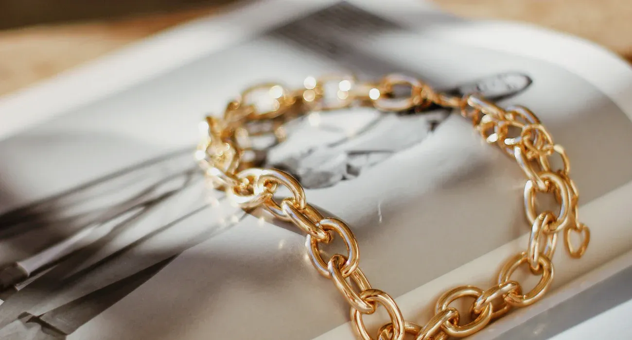 Close up of a golden stainless steel chain Close up of a golden stainless steel chain