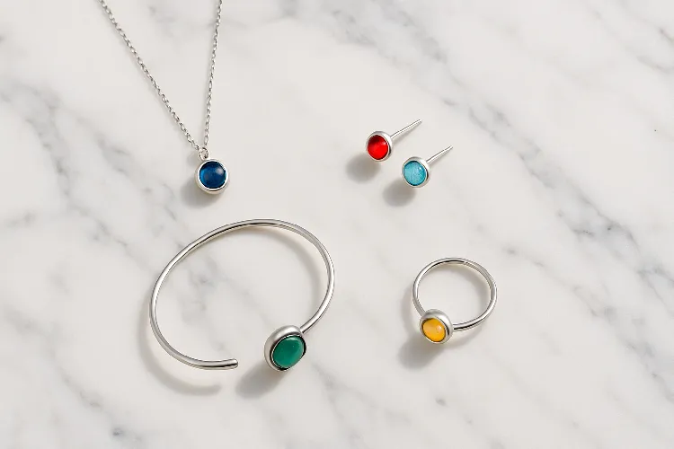 Modern birthstone jewelry on marble Modern birthstone jewelry on marble