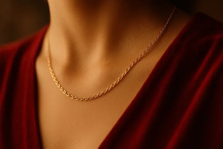 Gold necklace paired with a red dress Gold necklace paired with a red dress