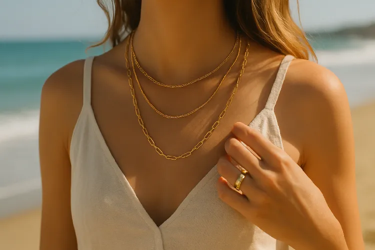 Women wear gold multi-layered necklaces and rings Women wear gold multi-layered necklaces and rings