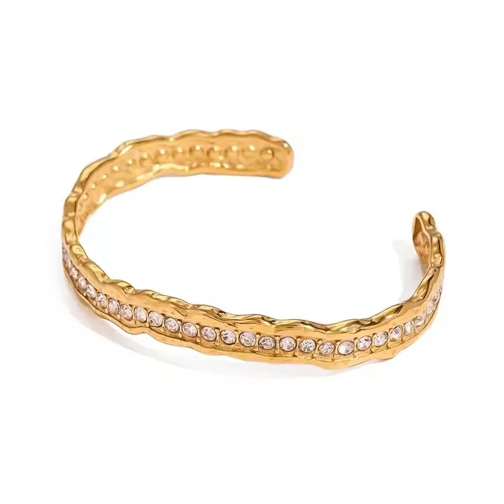 Copper cuff bracelet with crystals along the band