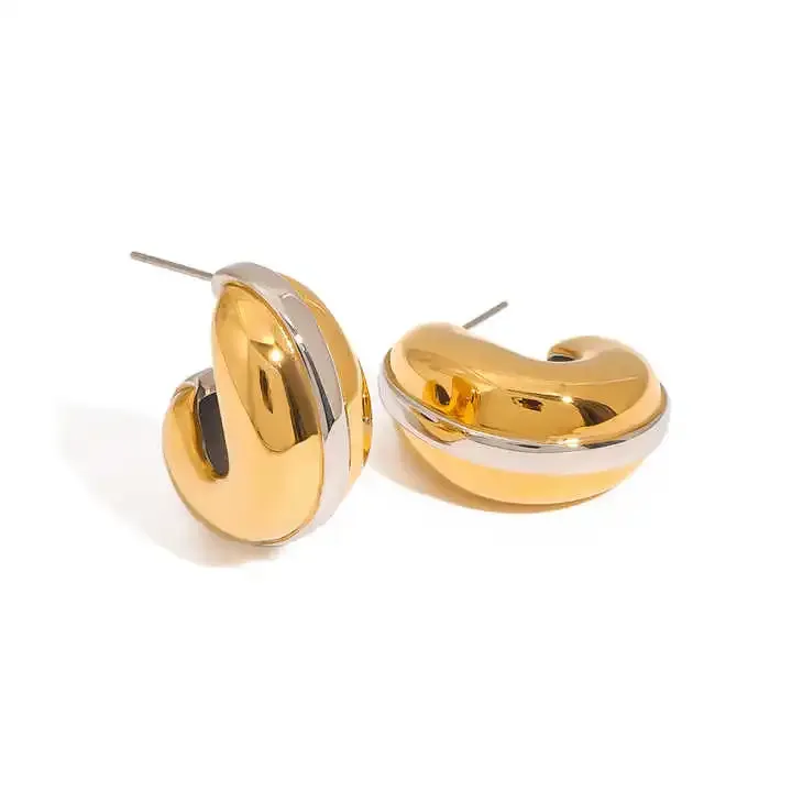 Gold and silver titanium hoop earrings with a bold curve