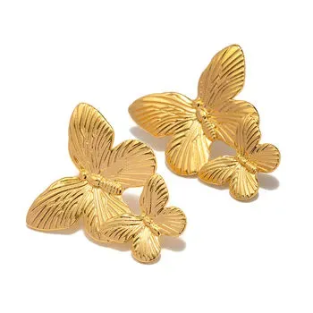 Gold butterfly titanium earrings with textured details