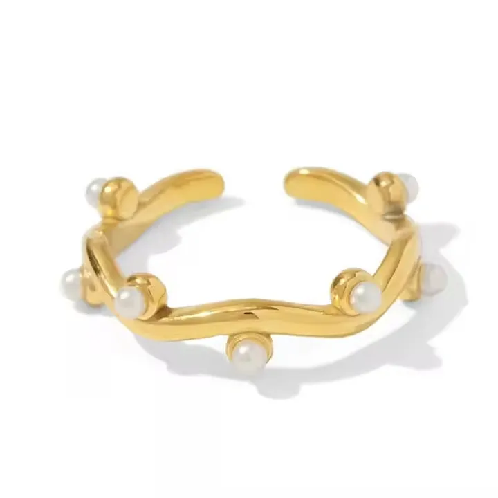 Gold open cuff ring with small pearls along its band