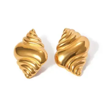 Gold swirl titanium earrings with a sculptural design