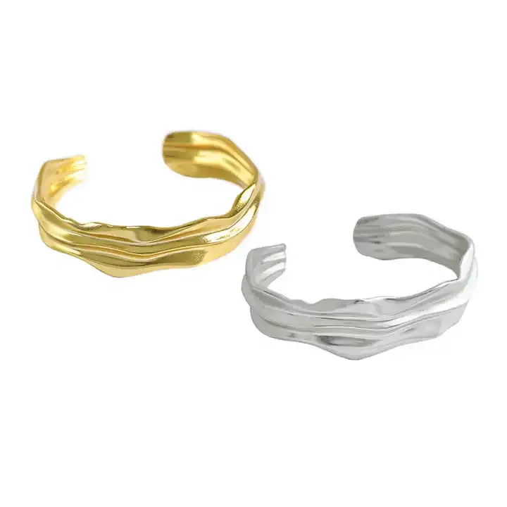 Silver and gold wavy textured open cuff bracelets
