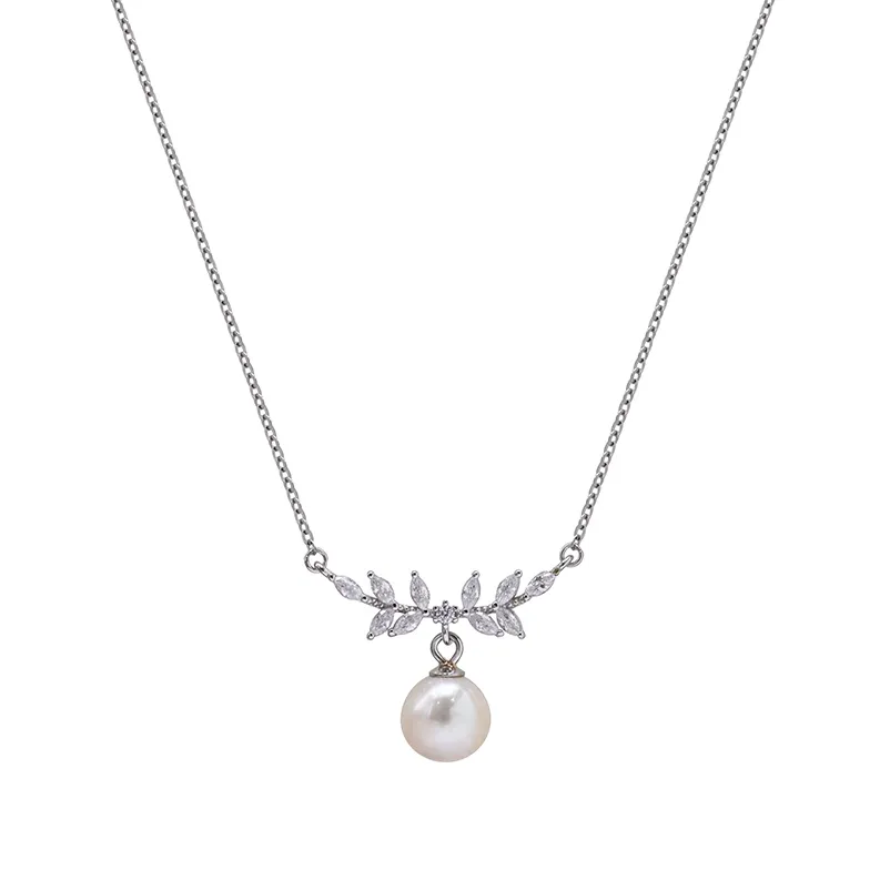 Silver floral necklace with a dangling pearl pendant