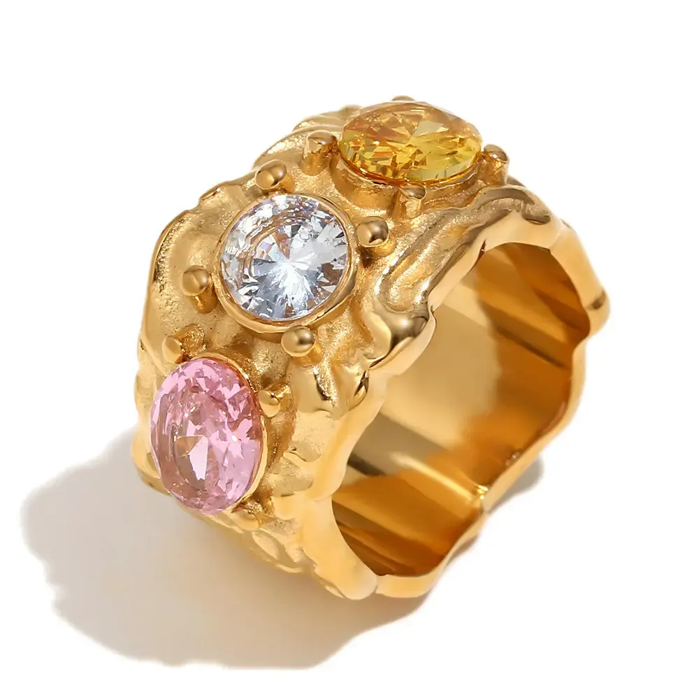 Wide copper ring with textured design and colorful gems