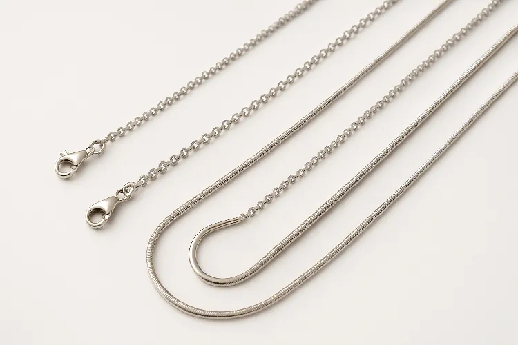 Display of thin-chain stainless steel necklaces stacked together Display of thin-chain stainless steel necklaces stacked together