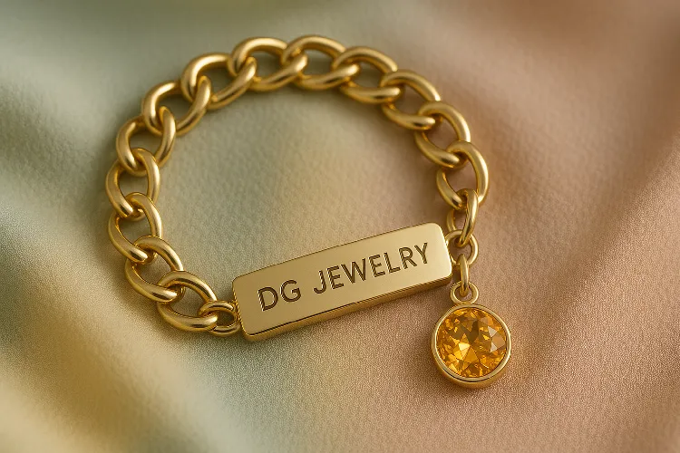 a custom stainless steel bracelet with engraved initials and a birthstone charm. a custom stainless steel bracelet with engraved initials and a birthstone charm.
