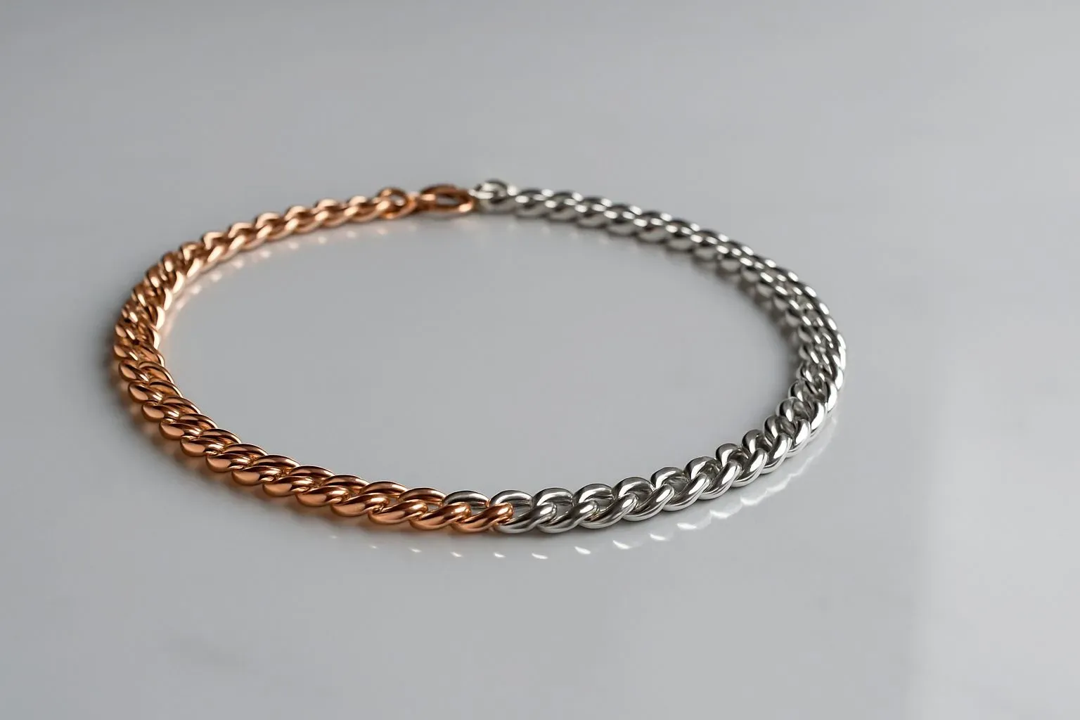 A comparison display of rose gold and silver necklaces