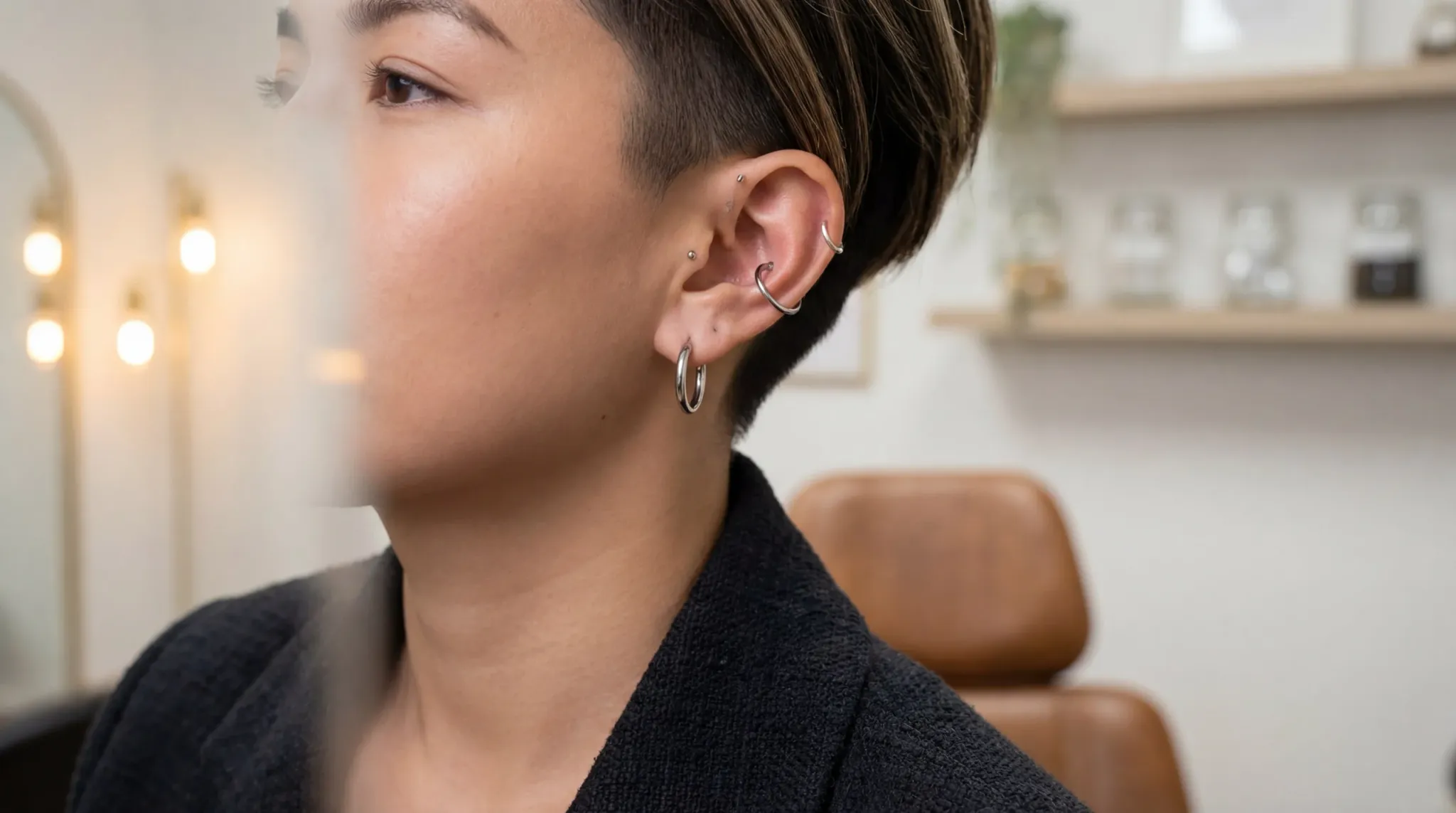 Conch piercing lifestyle photography showing a person with a perfectly healed ear curation in a professional setting.