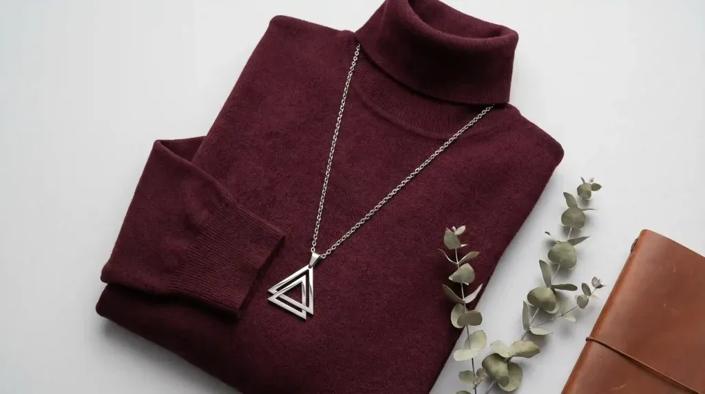 burgundy turtleneck pendant flatlay