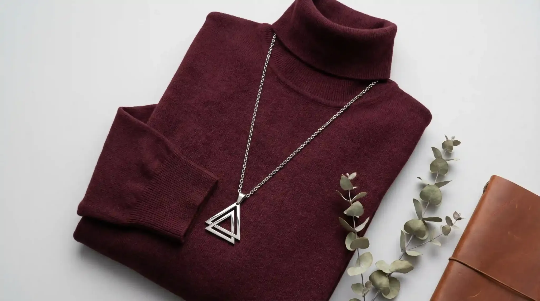 burgundy turtleneck pendant flatlay