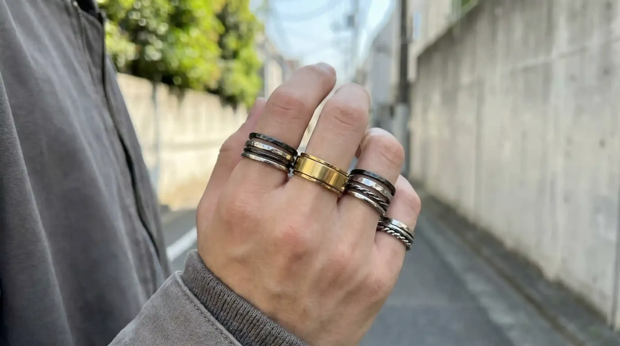 A 2026 jewelry trend flatlay featuring stackable rotating rings in gold and silver finishes