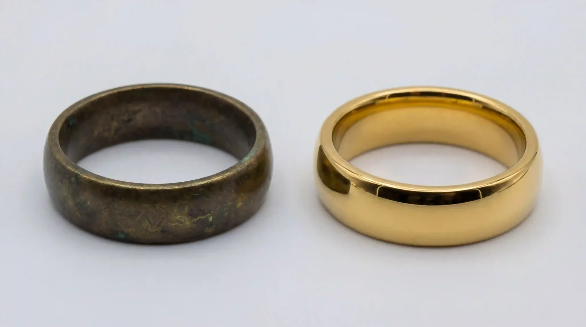Comparison of a tarnished brass ring and a high-quality 18k gold plated stainless steel ring
