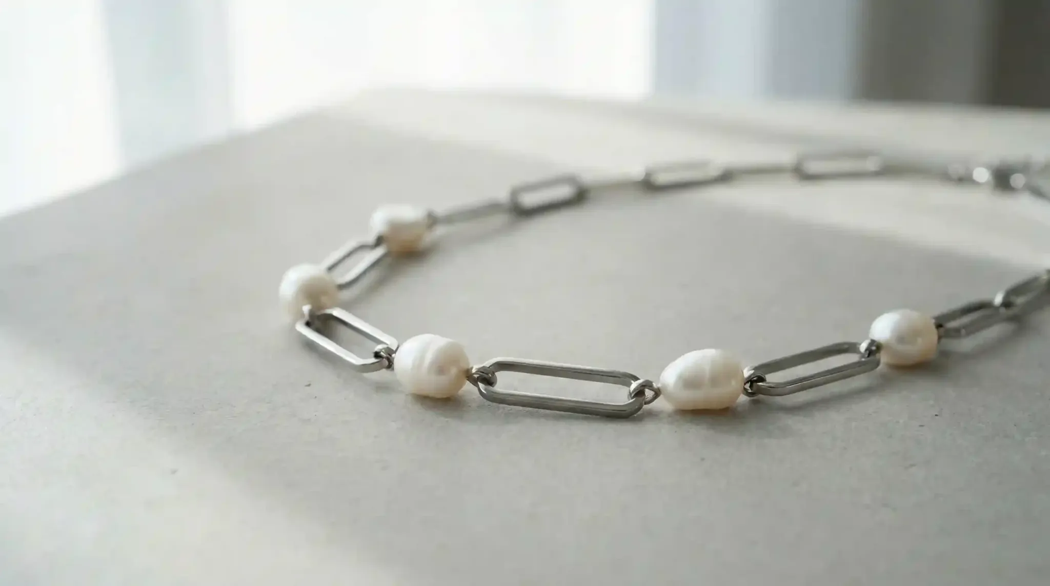 Lustrous Freshwater pearl necklace on a textured surface