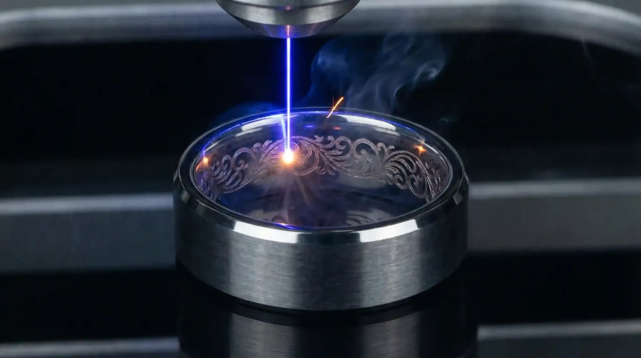 Laser technology being used to engrave a custom pattern onto a tungsten ring