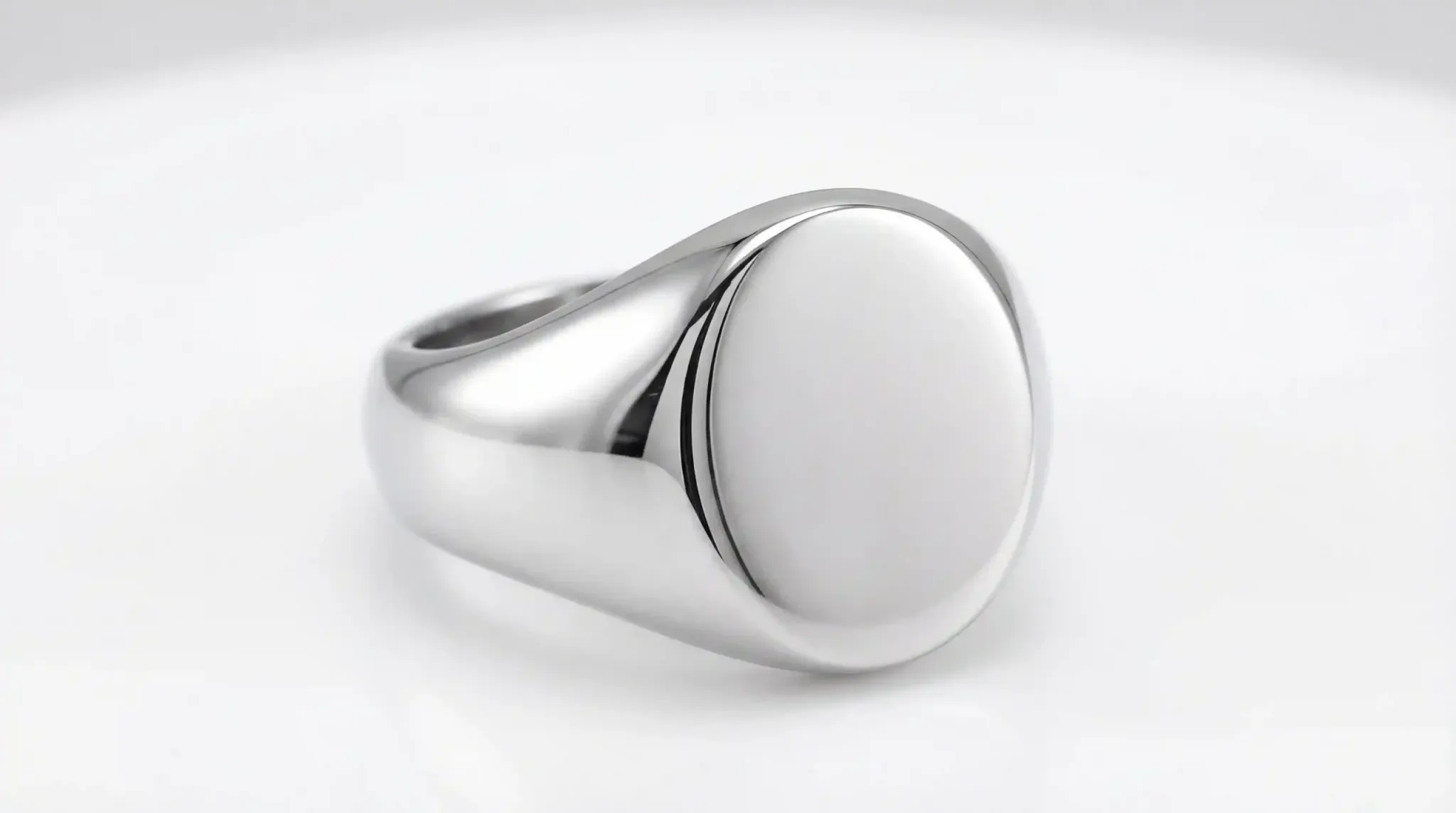 A sleek, polished oval signet ring crafted from 316L stainless steel