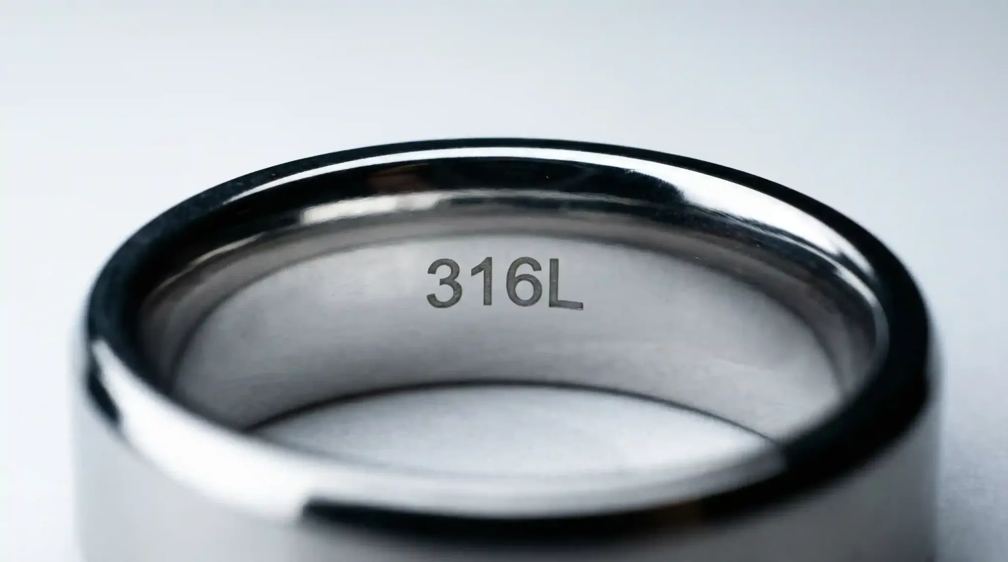 A macro shot of the interior of a ring showing the 316L hallmark for material verification.